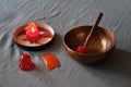 Massage items: oil, singing bowl, vacuum can and scented candle on textile linen background Royalty Free Stock Photo