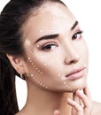 Massage lines on female face with vitiligo show directions.