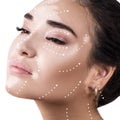 Massage lines on female face with vitiligo show directions.