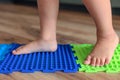 Massage puzzle mat. Toddler baby foot massage mat. Exercises for legs orthopedic massage carpet Royalty Free Stock Photo