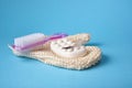 Massage soap, washcloth mitten and pumice stone with pink plastic handle and pedicure brush and feather Royalty Free Stock Photo