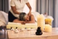 Massage, spa aroma candles and woman at beauty salon for wellness, spiritual service and body healing. Physiotherapy Royalty Free Stock Photo