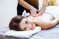 Massage and spa. Relaxing body massage for beautiful asian young woman. Royalty Free Stock Photo