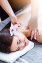 Massage and spa. Relaxing body massage for beautiful asian young woman. Royalty Free Stock Photo