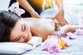 Massage and spa. Relaxing body massage for beautiful asian young woman. Royalty Free Stock Photo