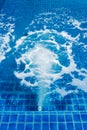 Massage and spa swimming pool with bubbles blue water Royalty Free Stock Photo