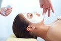 Massage therapist applying anti-aging cream Royalty Free Stock Photo