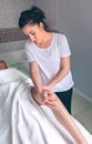 Massage therapist doing lymphatic drainage treatment to woman Royalty Free Stock Photo