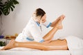 Massage therapist doing a therapeutic Thai foot massage Royalty Free Stock Photo