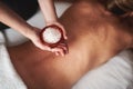 Massage therapist hold bowl with mineral salt Royalty Free Stock Photo