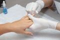 Massage therapist massaging hands of a woman in a beauty salon Royalty Free Stock Photo