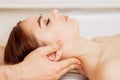 Massage therapist`s hands doing massage on head Royalty Free Stock Photo