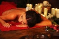 Massage of woman in spa salon. Luxary interior oriental therapy .