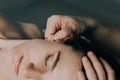 Massage women`s earlobe. Royalty Free Stock Photo