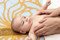 Massaging baby Royalty Free Stock Photo