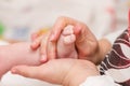 Massaging newborn baby feet