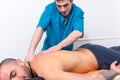 Masseur doing a back massage on a client Royalty Free Stock Photo