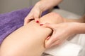 Masseur doing leg massage at beauty salon, close up. Royalty Free Stock Photo