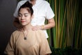 Masseur doing massage spa with treatment on Asian woman body in the Thai spa lifestyle, so relax and luxury.