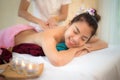 Masseur doing massage spa with treatment mud on Asian woman body in the Thai spa lifestyle, so relax and luxury. Royalty Free Stock Photo