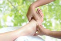 Masseur doing reflexology,Thai foot massage