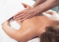 Masseur doing therapeutic massage on lady back Royalty Free Stock Photo