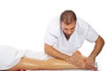 Masseur give therapeutic massage to woman legs Royalty Free Stock Photo