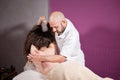 Masseur hands doing spine and back massage, neck and hand. Relaxed patient enjoys. Man hands massaging female. Spa Royalty Free Stock Photo