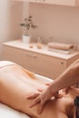 Masseur hands massaging female back free space Royalty Free Stock Photo