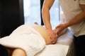 masseur makes anticellulite massage young woman in the spa salon. Body care concept. Special anticellulite treatment. Royalty Free Stock Photo