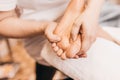Masseur massages active points on the feet - foot massage