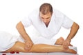 Masseur massaging woman's leg