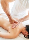 Masseur man doing massage manipulations on the scapula area zone close up image Royalty Free Stock Photo