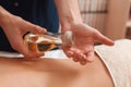 Masseur pouring aroma oil to hand closeup Royalty Free Stock Photo