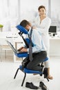 Masseur working in office Royalty Free Stock Photo