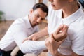 Masseuse doing arm massage for businessman Royalty Free Stock Photo