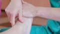 Masseuse doing Chinese foot massage close up