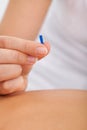 Masseuse holding needle Royalty Free Stock Photo