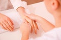Masseuse massaging hand Royalty Free Stock Photo
