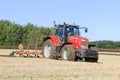 Massey Ferguson 7726 ploughing on stubble in crop field Royalty Free Stock Photo