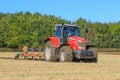 Massey Ferguson 7726 ploughing on stubble in crop field Royalty Free Stock Photo