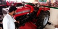 tractor presenting by honda automobile salesmen at showroom in India