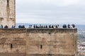 Massive Alhambra tower with visitors Royalty Free Stock Photo