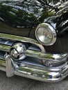 Chrome front of a historic American Ford Custom deluxe V8 from the 50\'s