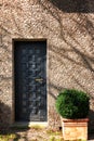 Massive antique outside wooden door of a chateau, castle with many small square windows Royalty Free Stock Photo