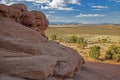 Massive boulders frame a scenic landscape in Monument Valley. Royalty Free Stock Photo