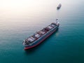 A massive cargo ship wood chips carrier in the sea, aerial view