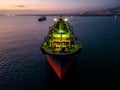 A massive cargo ship wood chips carrier in the sea, aerial view