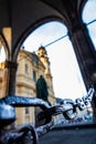 A massive chain of the feldherrenhalle odeonsplatz in munich with the theatine church in the background