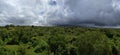 Massive Clouds Above Lush Forest Panorama